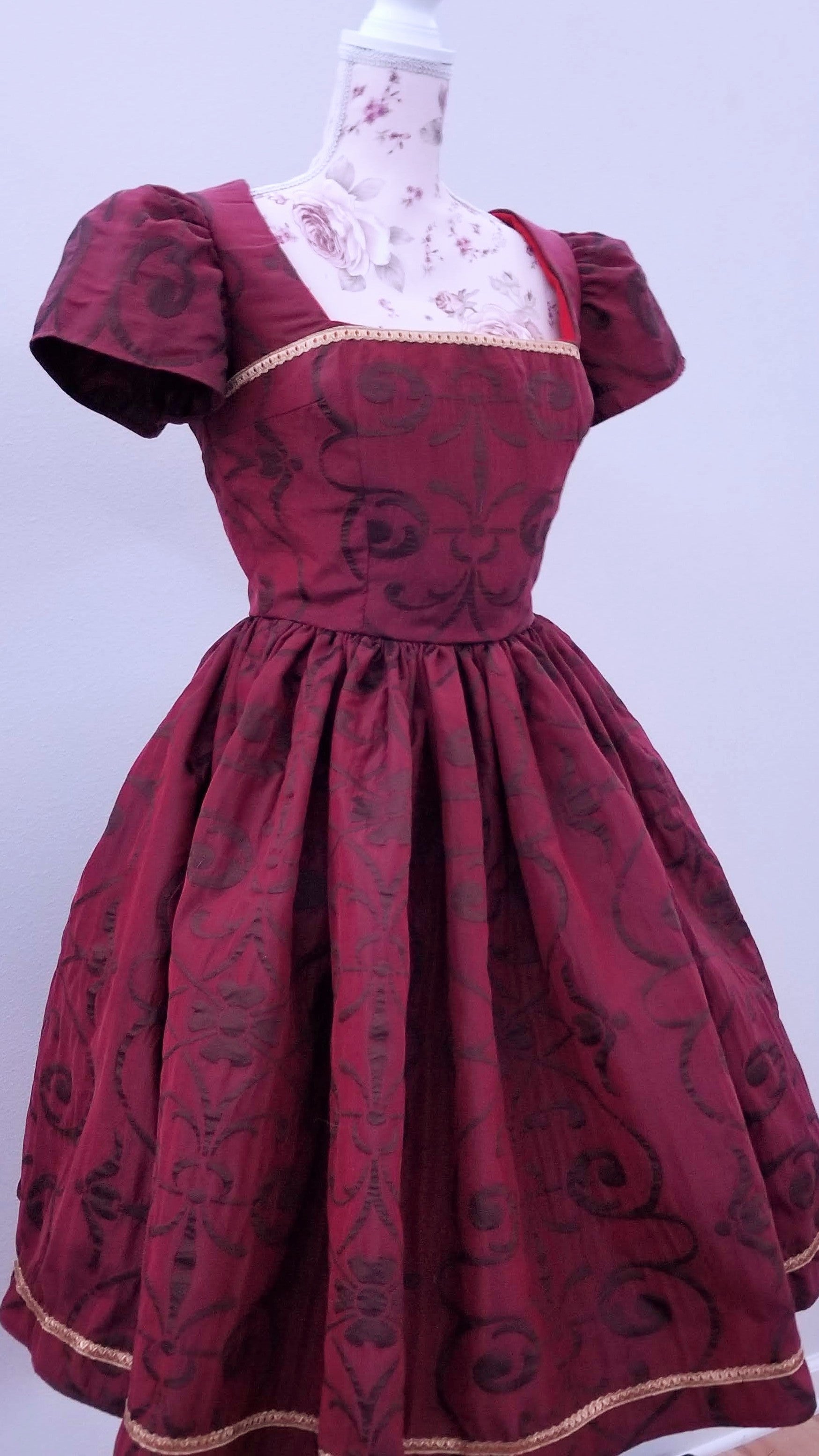 This rich in burgundy color is designed as a one-of-a-kind dress made personally by Hollyville shop owner, Pamela Marie.