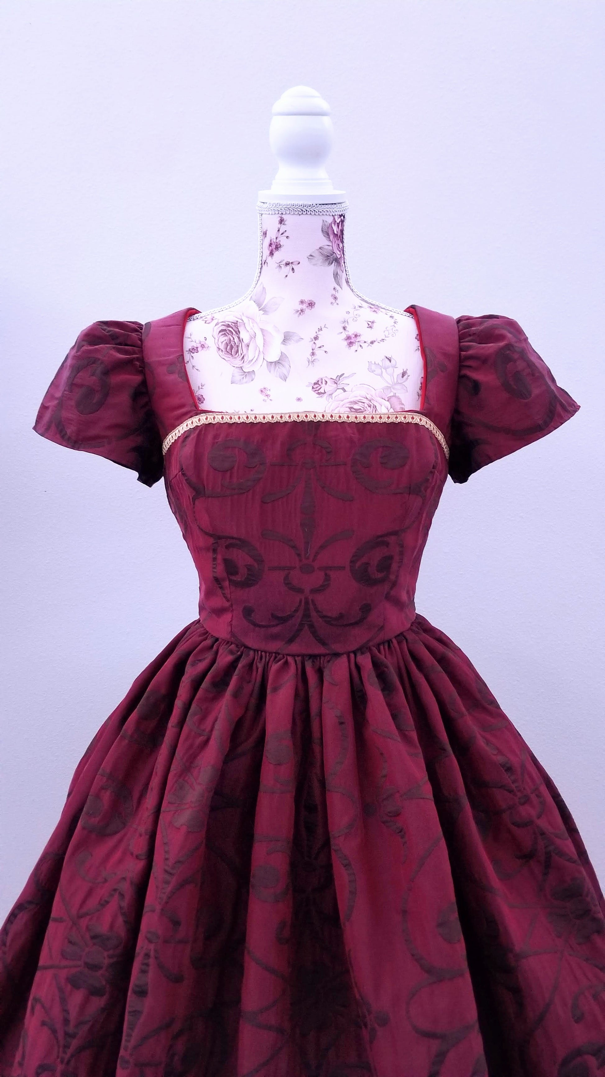 This rich in burgundy color is designed as a one-of-a-kind dress made personally by Hollyville shop owner, Pamela Marie.