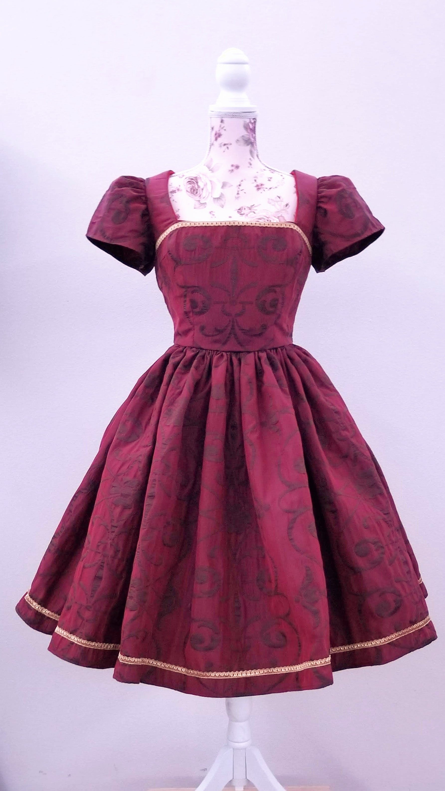 This rich in burgundy color is designed as a one-of-a-kind dress made personally by Hollyville shop owner, Pamela Marie.
