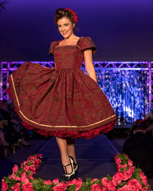 This rich in burgundy color is designed as a one-of-a-kind dress made personally by Hollyville shop owner, Pamela Marie.