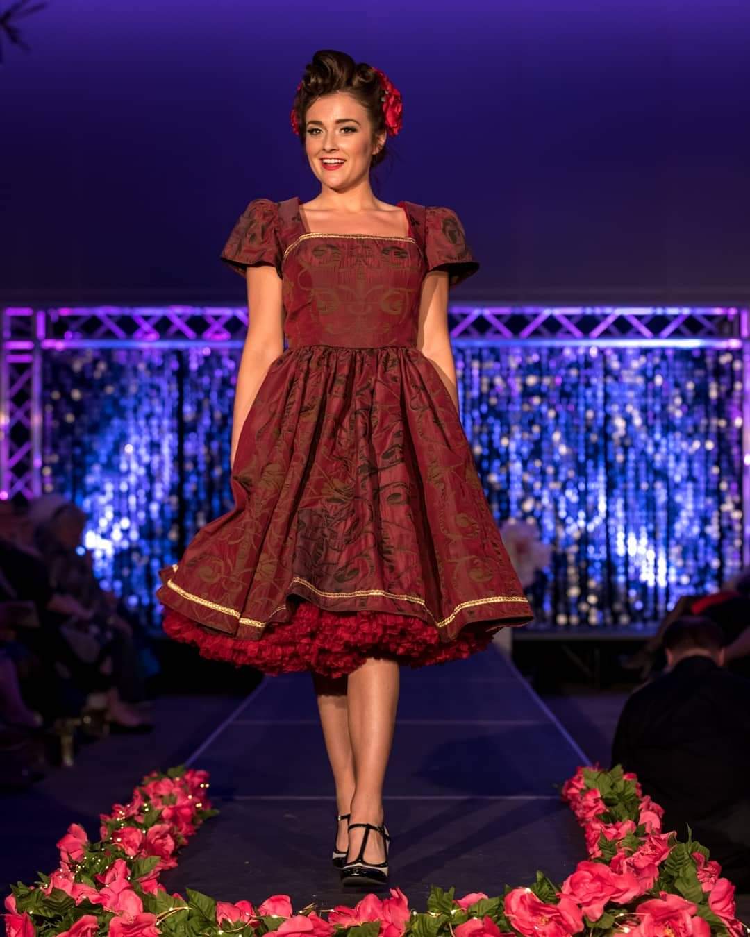 This rich in burgundy color is designed as a one-of-a-kind dress made personally by Hollyville shop owner, Pamela Marie.