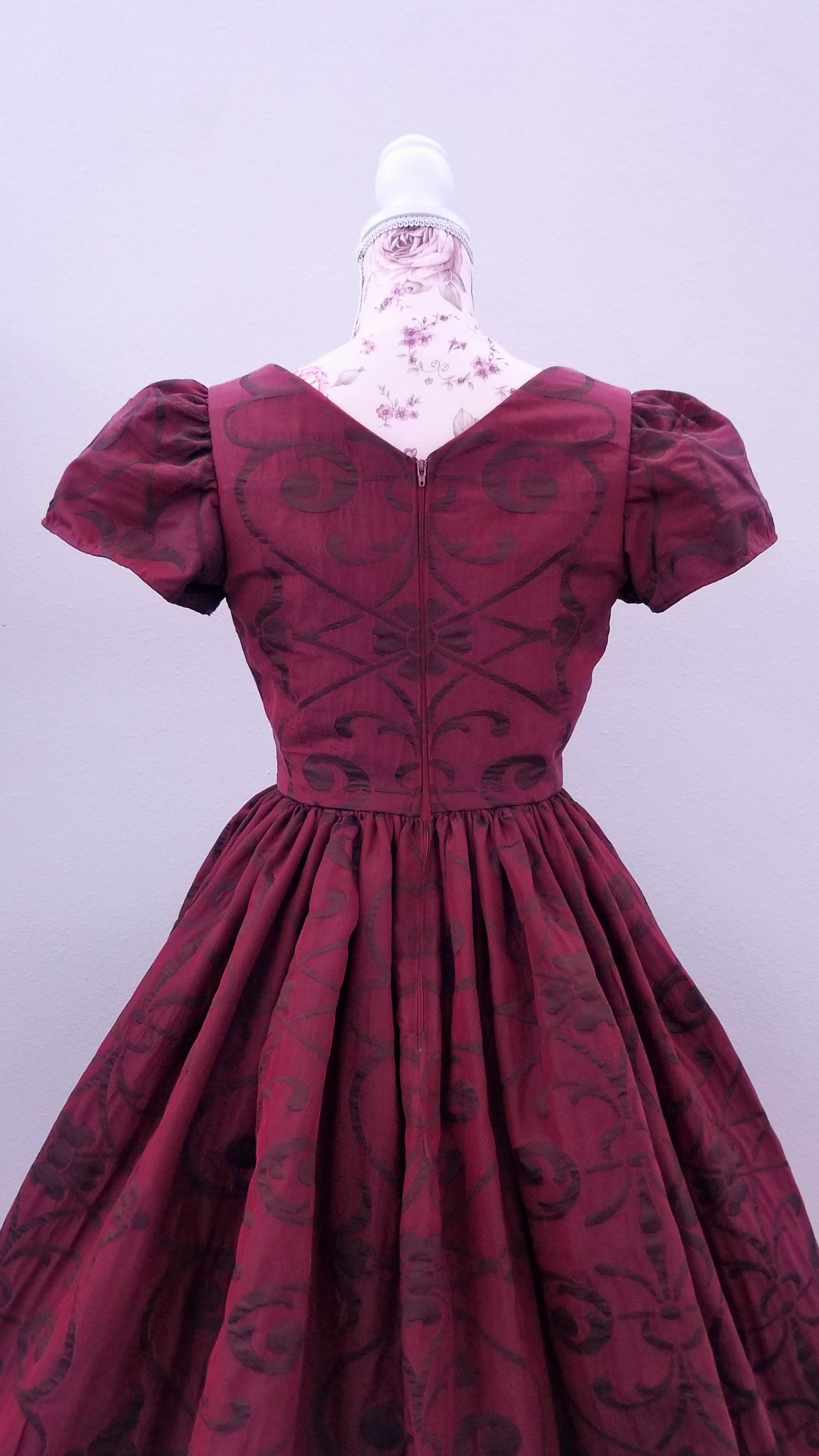 This rich in burgundy color is designed as a one-of-a-kind dress made personally by Hollyville shop owner, Pamela Marie.
