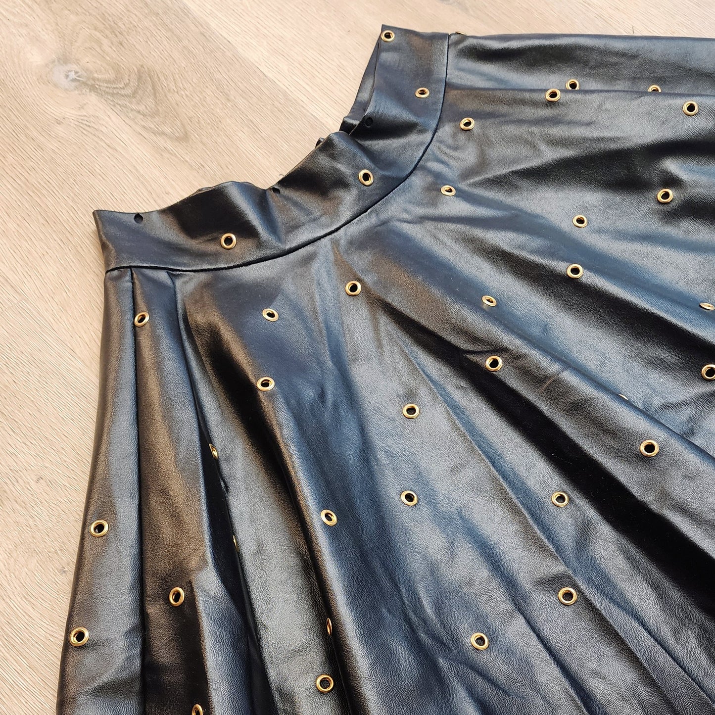 Black Vegan Leather Gold Metal Eyelet Skirt by Hollyville