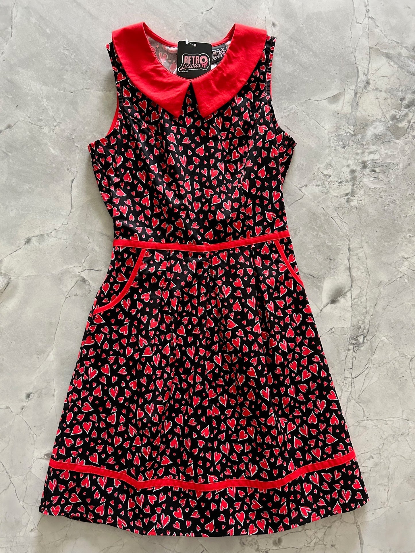 1960's inspired vintage dress with red heart pattern by Retrolicious. Perfect for Valentine's Day!