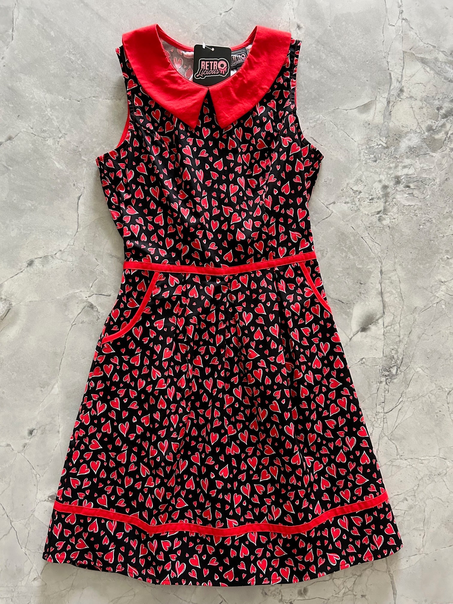 1960's inspired vintage dress with red heart pattern by Retrolicious. Perfect for Valentine's Day!