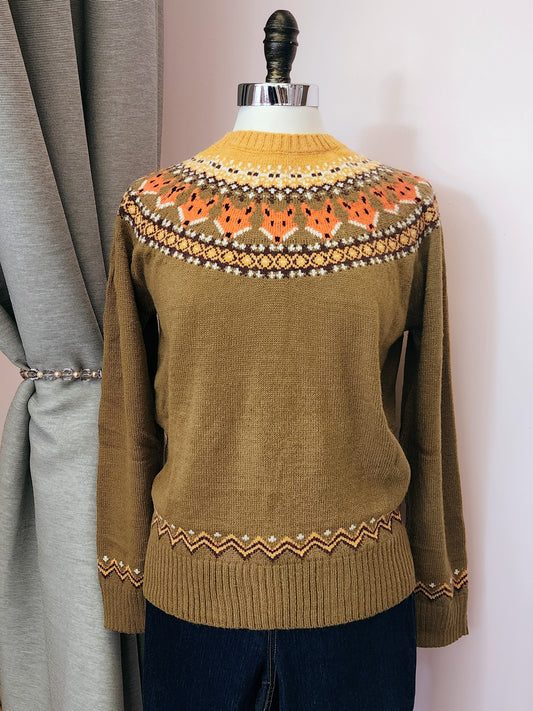 Green sweater with intricate fox pattern on a mannequin against a neutral background | Hollyville | South Milwaukee 