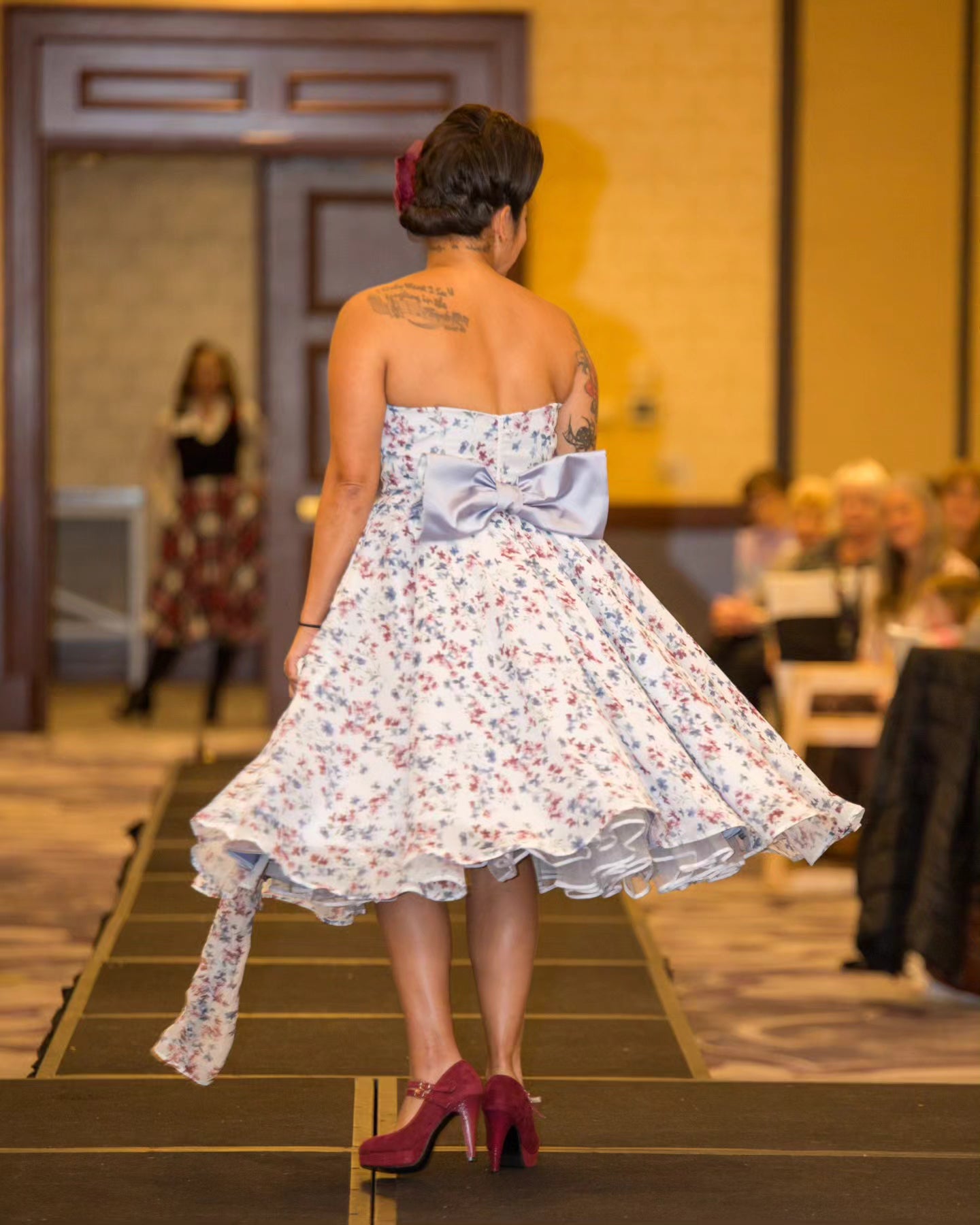 As seen in Zonta Club of Milwaukee Fashion Show 

Floral Chiffon 1950's inspired dress

Pleated bodice on a chevron, fully lined and boned

Three layers of a full circle skirt with pockets