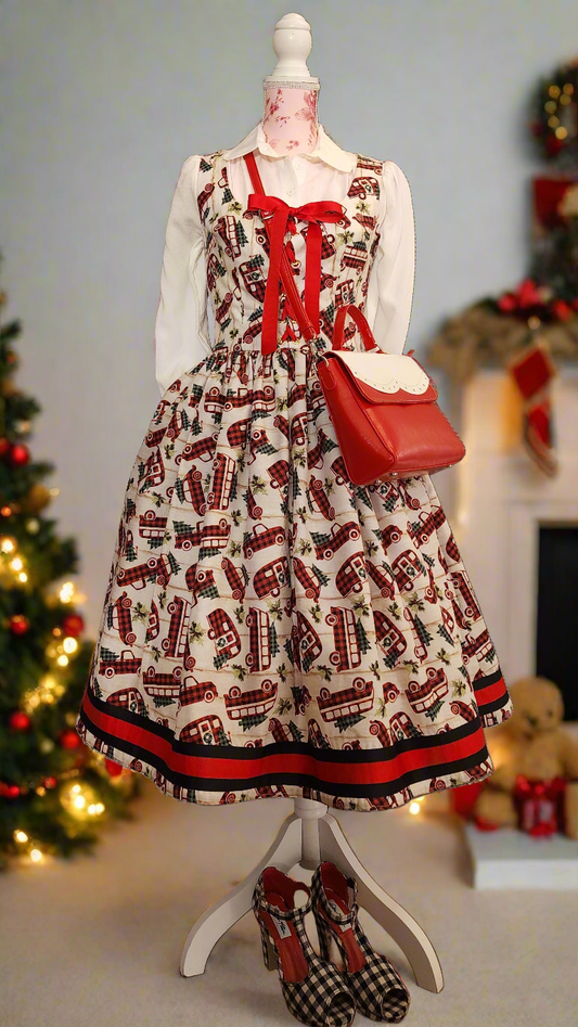 Novelty Volkwagen Camper and truck print cotton Holiday Christmas dress bordered with rows of grosgrain ribbon at the hem of the skirt, with pockets, and a lace front bodice.